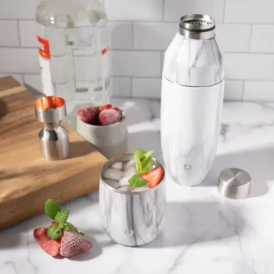 Marble cocktail shaker and glass with ice